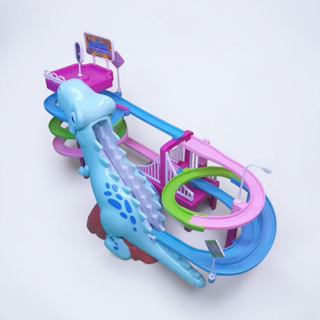 A colorful plastic dinosaur roller coaster toy set on a plain white background. The toy features a light blue dinosaur body with darker blue spots, a pink and blue roller coaster track, green loops, and a small signpost.